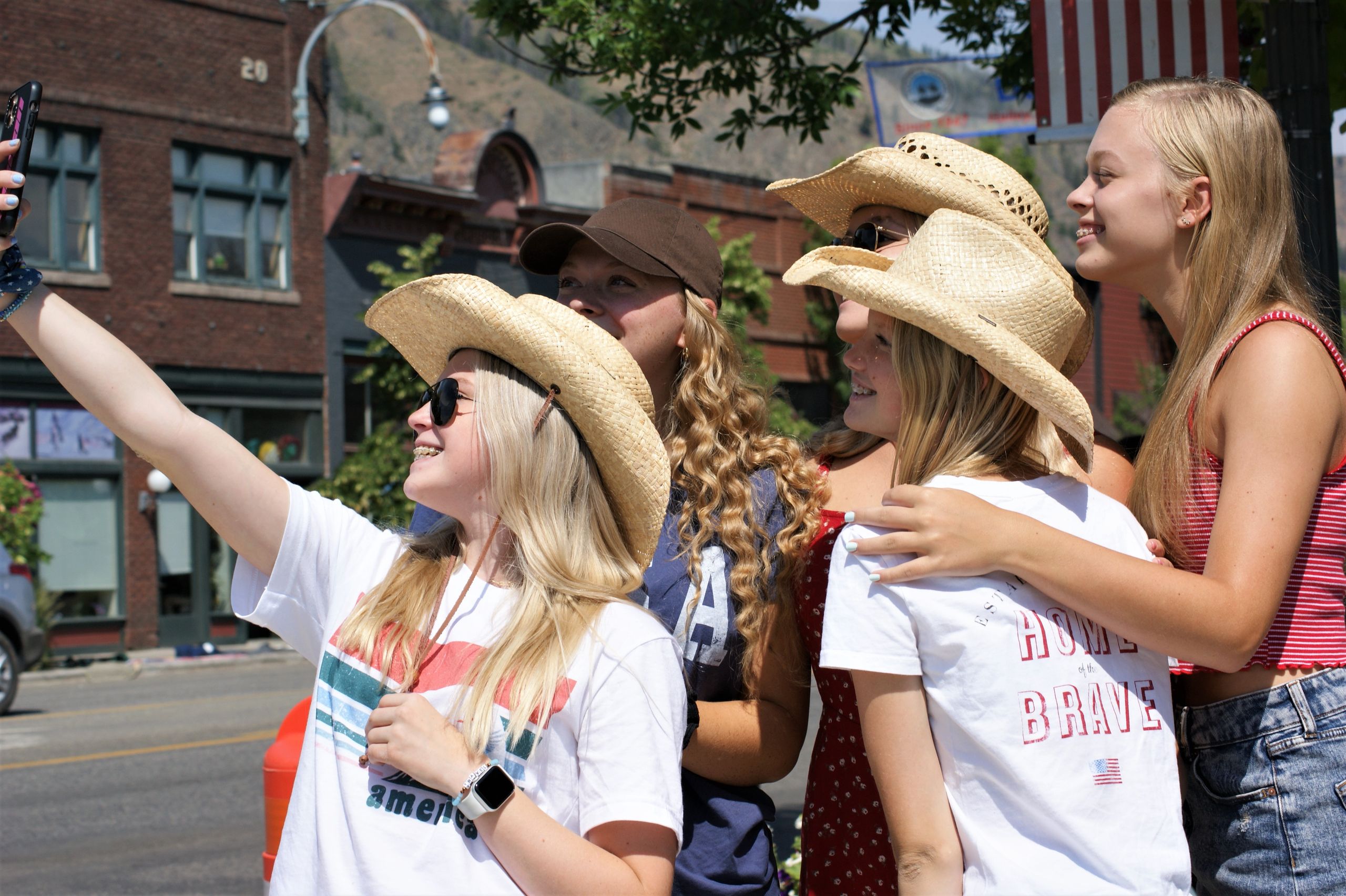 Group of teenage girls taking a selfie during a day out in Hailey, Idaho, USA.